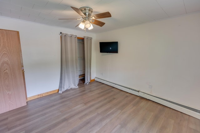 6 Goodbout Rd, Lincoln, NH 03251 - unfurnished bedroom with a baseboard radiator, light wood-style floors, and a ceiling fan