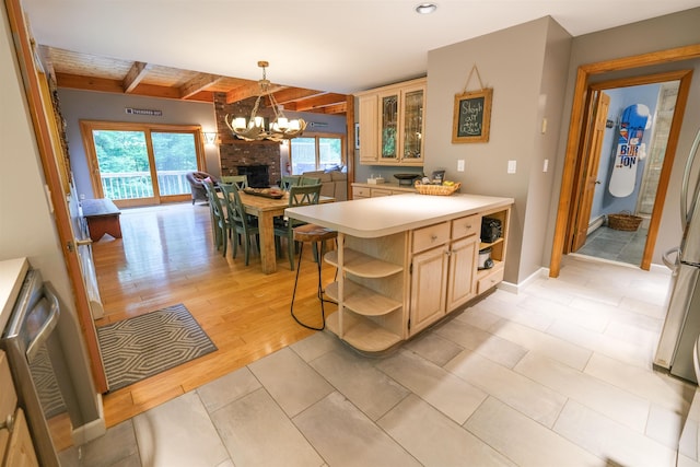 26 Country Xing, Ludlow, VT 05149 - kitchen featuring open shelves, a chandelier, light countertops, beamed ceiling, and glass insert cabinets