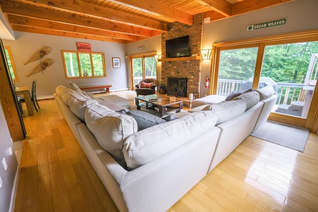 26 Country Xing, Ludlow, VT 05149 - living room featuring a fireplace, light wood-style floors, a wood ceiling with exposed beams, and a baseboard heating unit