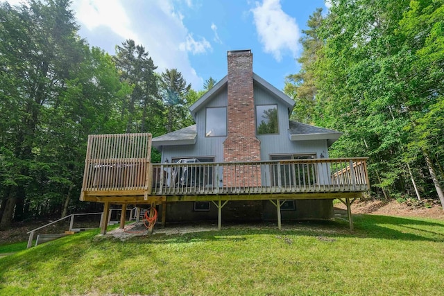 26 Country Xing, Ludlow, VT 05149 - rear view of property featuring a chimney, a deck, and a yard