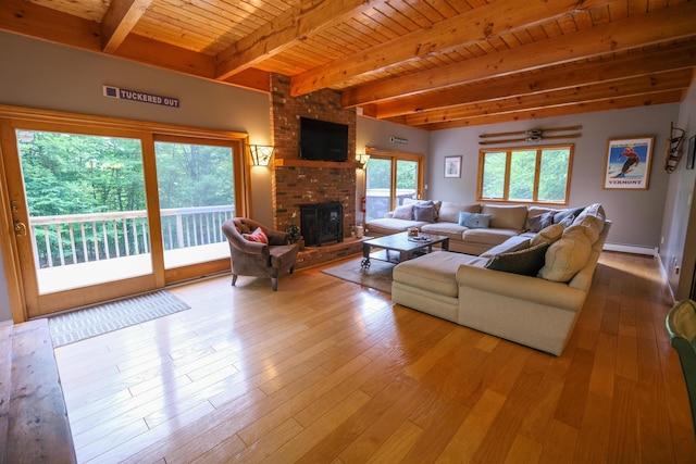 26 Country Xing, Ludlow, VT 05149 - living room featuring a wooden ceiling with exposed beams, a fireplace, a baseboard heating unit, and wood-type flooring