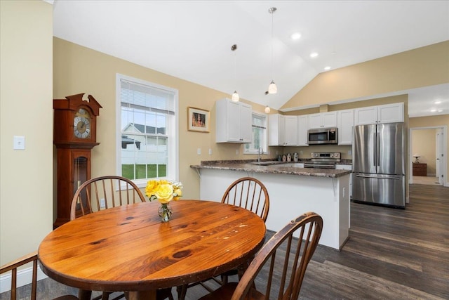 5 Rolling Hills Dr, Tilton, NH 03276 - dining space featuring dark wood finished floors, lofted ceiling, and recessed lighting