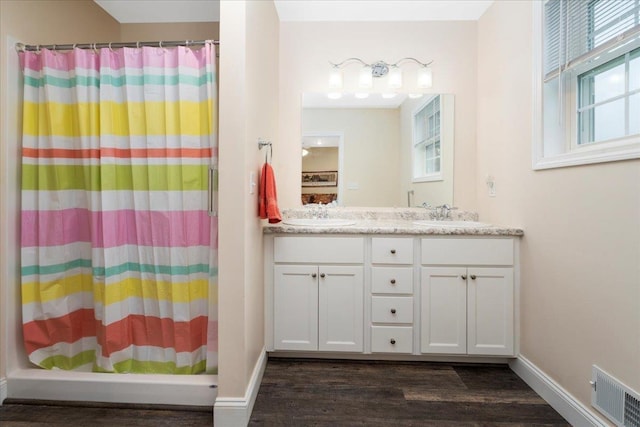 5 Rolling Hills Dr, Tilton, NH 03276 - full bathroom with wood finished floors and double vanity