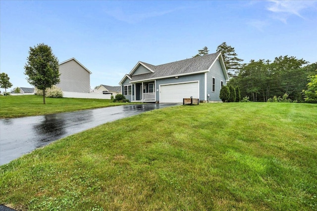 5 Rolling Hills Dr, Tilton, NH 03276 - view of front facade with asphalt driveway, an attached garage, and a front lawn