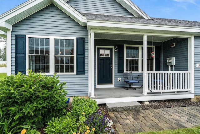 5 Rolling Hills Dr, Tilton, NH 03276 - entrance to property featuring a porch and roof with shingles