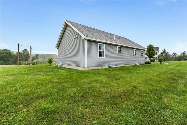 5 Rolling Hills Dr, Tilton, NH 03276 - view of home's exterior featuring a yard and a shingled roof