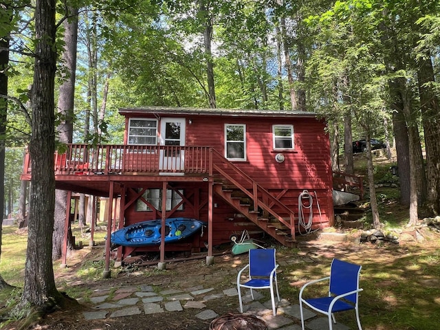 224 Nippo Ct, Barrington, NH 03825 - back of property featuring stairs and a wooden deck