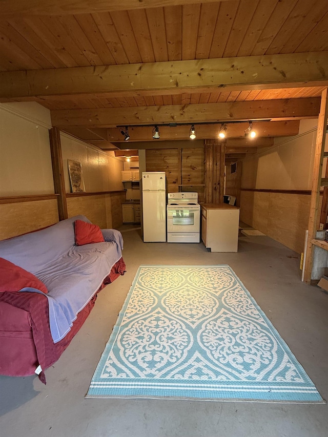 1442 Ridge Rd, Randolph, VT 05061 - bedroom with freestanding refrigerator, rail lighting, wooden ceiling, concrete floors, and wooden walls