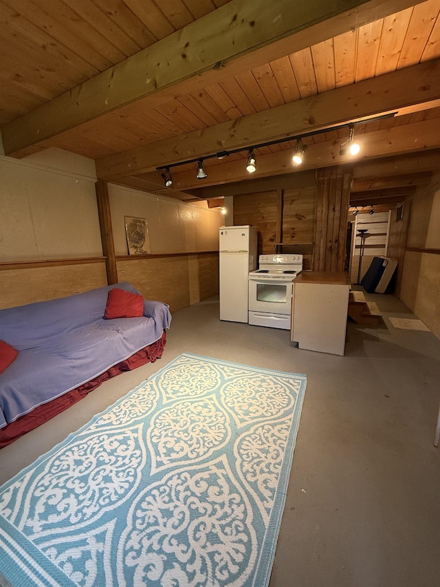1442 Ridge Rd, Randolph, VT 05061 - bedroom featuring freestanding refrigerator, track lighting, finished concrete flooring, and a wooden ceiling with exposed beams