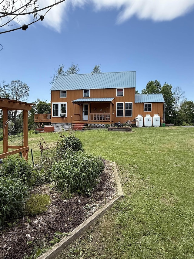 1442 Ridge Rd, Randolph, VT 05061 - rear view of house with a metal roof, a lawn, and a wooden deck