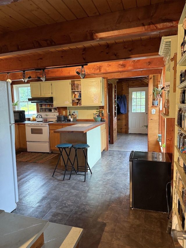 1442 Ridge Rd, Randolph, VT 05061 - kitchen with white appliances, under cabinet range hood, open shelves, a wood ceiling with exposed beams, and plenty of natural light