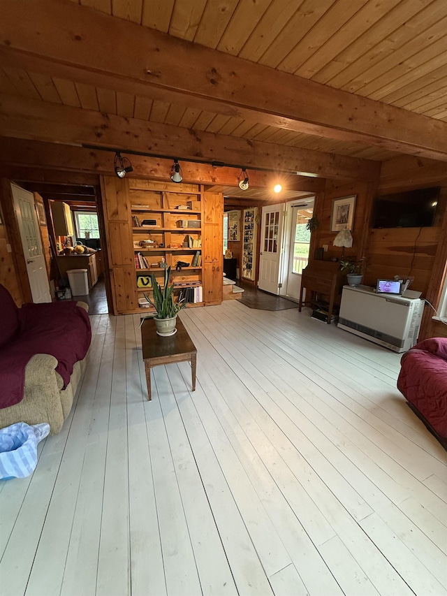 1442 Ridge Rd, Randolph, VT 05061 - living room featuring a wood ceiling with exposed beams, healthy amount of natural light, wood walls, and hardwood / wood-style flooring