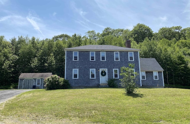 69 Emerson Hill Rd, New Ipswich, NH 03071 - colonial-style house with a chimney, a front lawn, an outdoor structure, and asphalt driveway