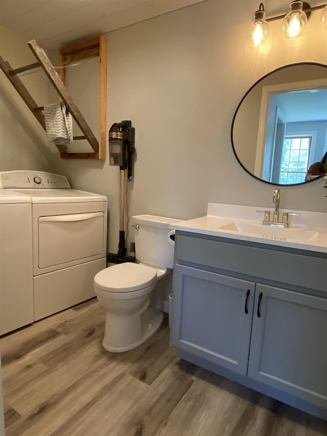 69 Emerson Hill Rd, New Ipswich, NH 03071 - bathroom featuring independent washer and dryer, wood finished floors, and vanity