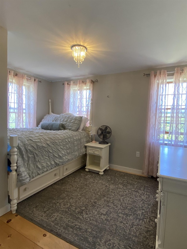 69 Emerson Hill Rd, New Ipswich, NH 03071 - bedroom featuring multiple windows and a chandelier