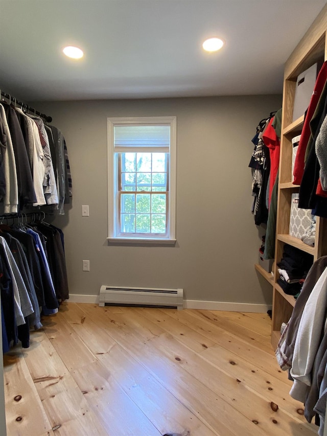 69 Emerson Hill Rd, New Ipswich, NH 03071 - spacious closet with a baseboard heating unit and wood-type flooring