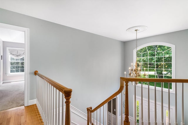 11 Mcafee Farm Rd, Bedford, NH 03110 - stairs with wood finished floors and a chandelier