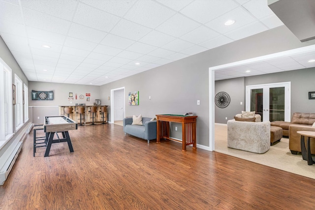 11 Mcafee Farm Rd, Bedford, NH 03110 - recreation room with french doors, wood finished floors, a paneled ceiling, recessed lighting, and baseboard heating