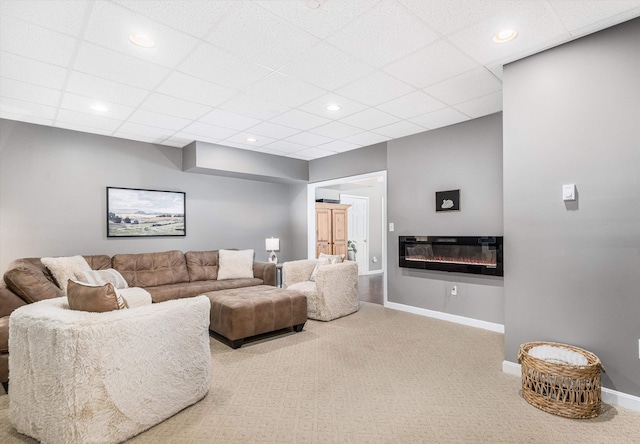 11 Mcafee Farm Rd, Bedford, NH 03110 - living area featuring carpet floors, a paneled ceiling, a glass covered fireplace, and recessed lighting