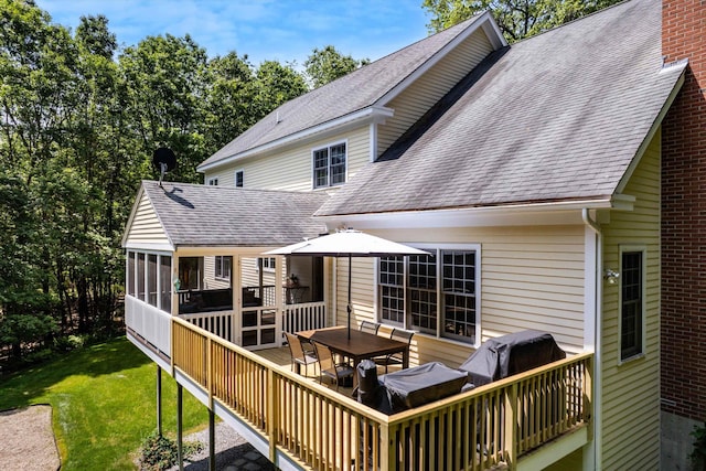 11 Mcafee Farm Rd, Bedford, NH 03110 - back of property featuring roof with shingles, outdoor dining space, and a sunroom