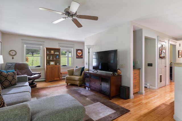 204 Mary Dr, Richmond, VT 05477 - living area with light wood finished floors, a baseboard radiator, and ceiling fan