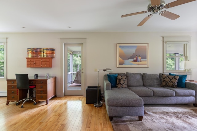 204 Mary Dr, Richmond, VT 05477 - living area featuring plenty of natural light, light wood-style flooring, baseboard heating, and ceiling fan