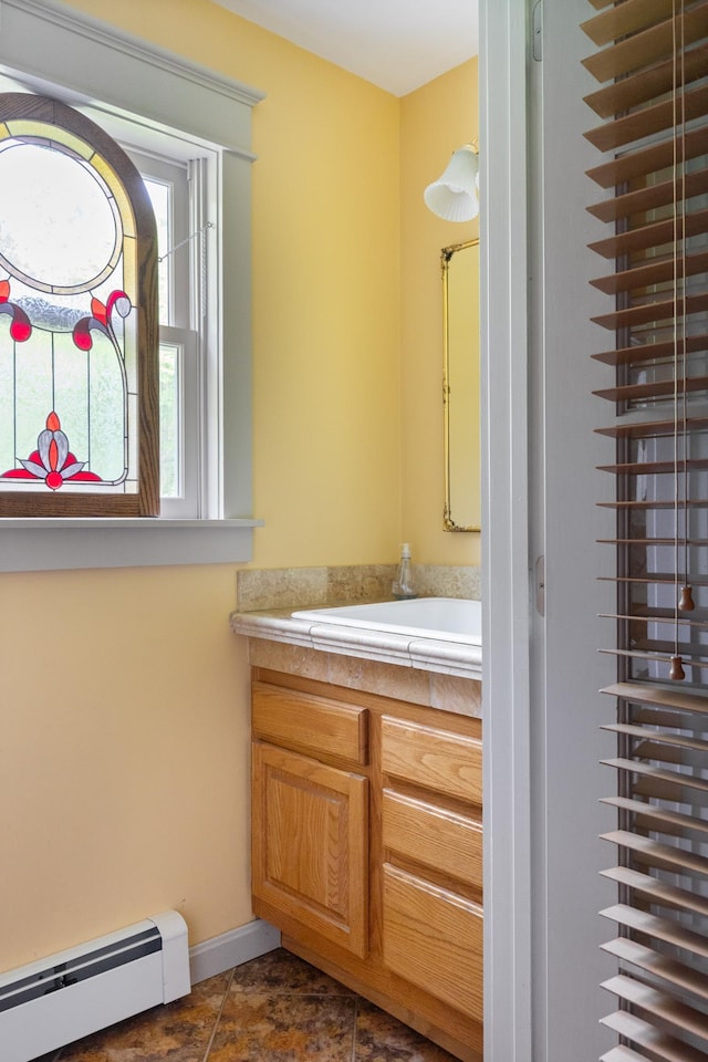 204 Mary Dr, Richmond, VT 05477 - bathroom with a baseboard radiator and vanity