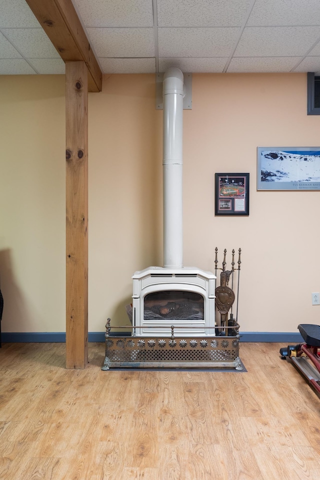 204 Mary Dr, Richmond, VT 05477 - detailed view of a paneled ceiling, a wood stove, and wood finished floors