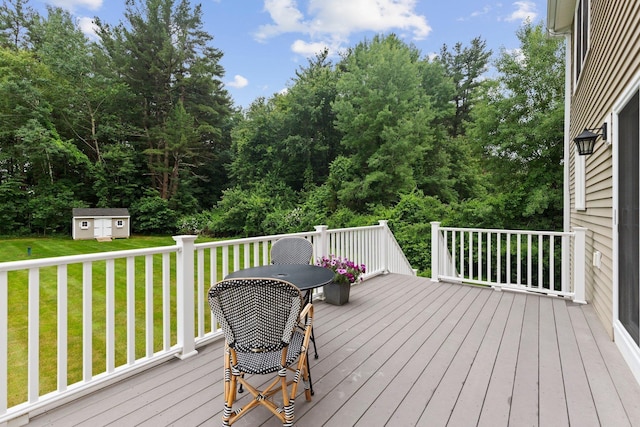12 Cushman Way, Greenland, NH 03840 - wooden deck featuring a lawn and a storage unit