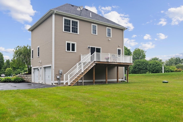 12 Cushman Way, Greenland, NH 03840 - rear view of house featuring a garage, asphalt driveway, a deck, stairs, and a lawn