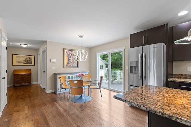 12 Cushman Way, Greenland, NH 03840 - dining space featuring wood finished floors and a chandelier