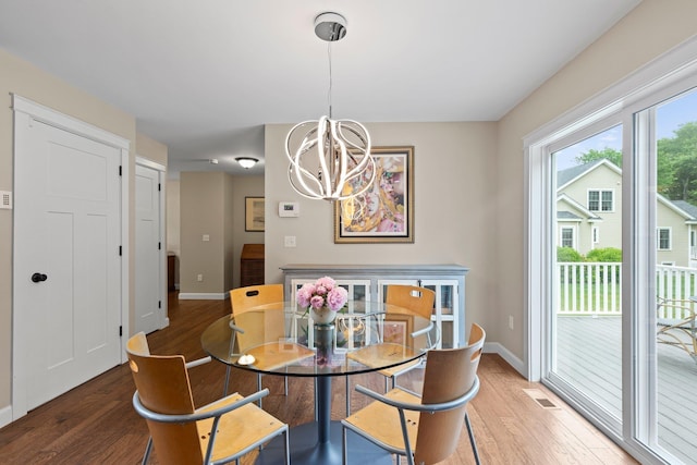 12 Cushman Way, Greenland, NH 03840 - dining room featuring a chandelier and wood finished floors
