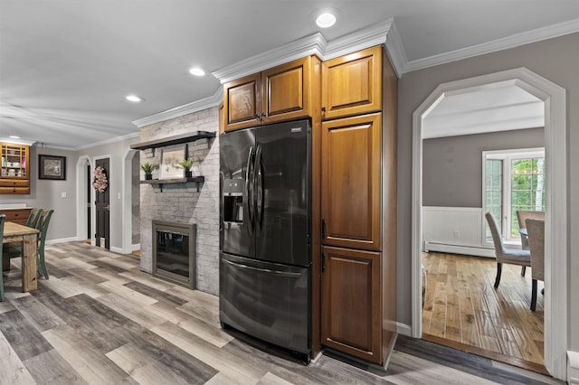 2 Ridgewood Dr, Kingston, NH 03848 - kitchen featuring black refrigerator with ice dispenser, ornamental molding, a baseboard heating unit, light wood finished floors, and recessed lighting