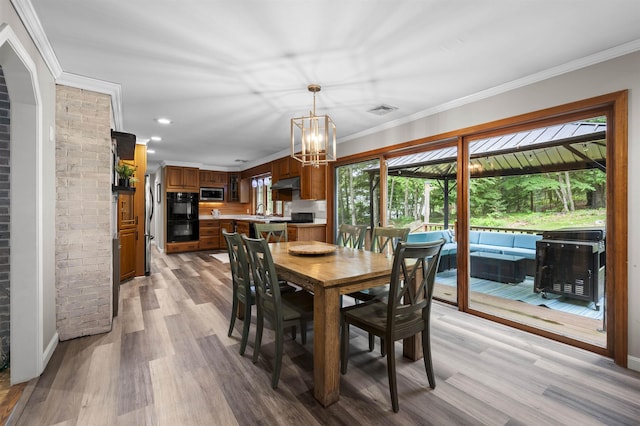 2 Ridgewood Dr, Kingston, NH 03848 - dining space with light wood-style flooring, a chandelier, crown molding, and recessed lighting