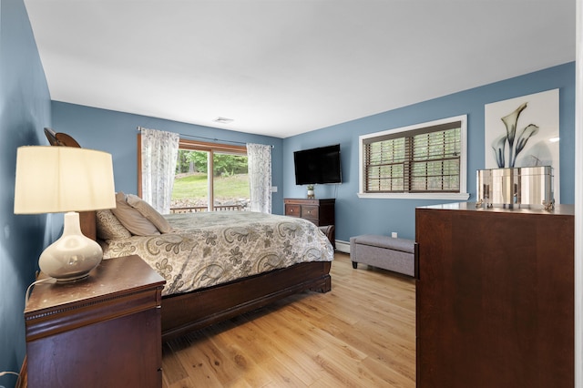 2 Ridgewood Dr, Kingston, NH 03848 - bedroom featuring wood finished floors, access to outside, and baseboard heating