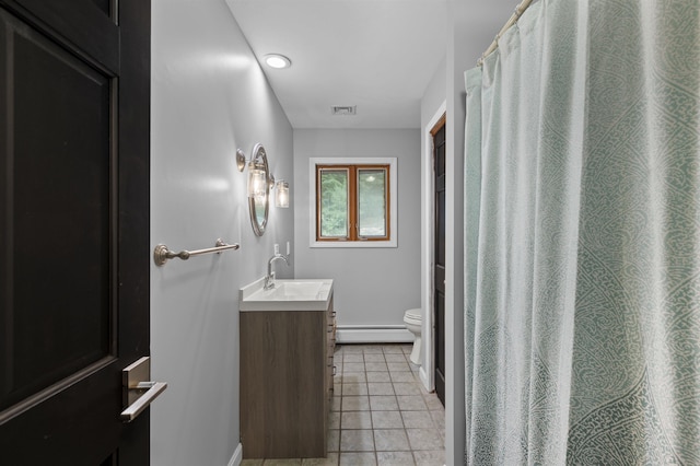 2 Ridgewood Dr, Kingston, NH 03848 - full bath with baseboard heating, vanity, and tile patterned floors