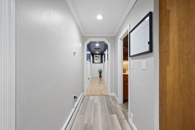 2 Ridgewood Dr, Kingston, NH 03848 - hall featuring light wood-type flooring, a baseboard heating unit, crown molding, arched walkways, and recessed lighting