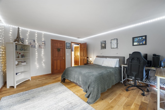 2 Ridgewood Dr, Kingston, NH 03848 - bedroom featuring light wood finished floors and an office area