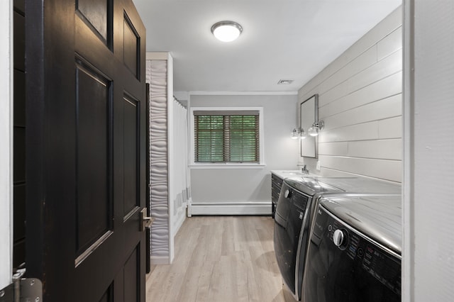 2 Ridgewood Dr, Kingston, NH 03848 - laundry room with baseboard heating, light wood finished floors, separate washer and dryer, and wood walls
