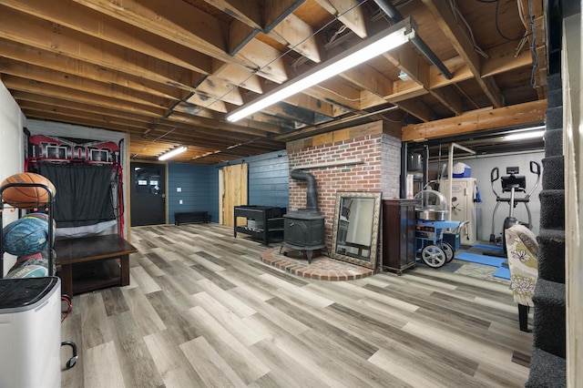 2 Ridgewood Dr, Kingston, NH 03848 - finished basement with a wood stove and wood finished floors