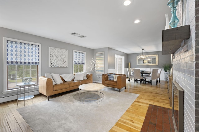 2 Ridgewood Dr, Kingston, NH 03848 - living area featuring wood finished floors, recessed lighting, and a chandelier