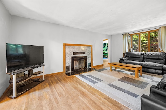 17 N Ave, Plaistow, NH 03865 - living area with wood finished floors and a fireplace