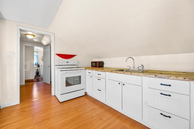 17 N Ave, Plaistow, NH 03865 - kitchen featuring electric range, white cabinetry, light wood finished floors, light countertops, and lofted ceiling