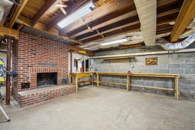 17 N Ave, Plaistow, NH 03865 - unfinished basement with a workshop area and a brick fireplace