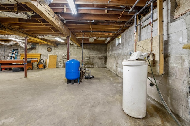 17 N Ave, Plaistow, NH 03865 - unfinished basement featuring a water pressure tank and a water softener system