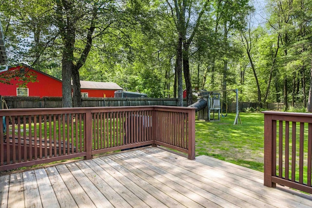 17 N Ave, Plaistow, NH 03865 - wooden deck with a playground and a fenced backyard