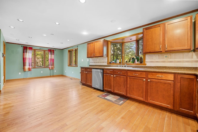 17 N Ave, Plaistow, NH 03865 - kitchen featuring stainless steel dishwasher, tasteful backsplash, brown cabinets, light wood-style floors, and recessed lighting