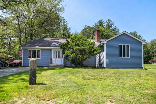 17 N Ave, Plaistow, NH 03865 - view of front of house featuring a chimney and a front yard