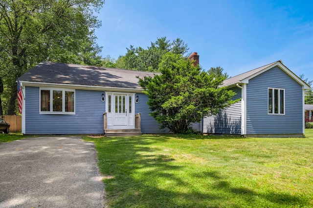 17 N Ave, Plaistow, NH 03865 - view of front of home with a chimney and a front yard