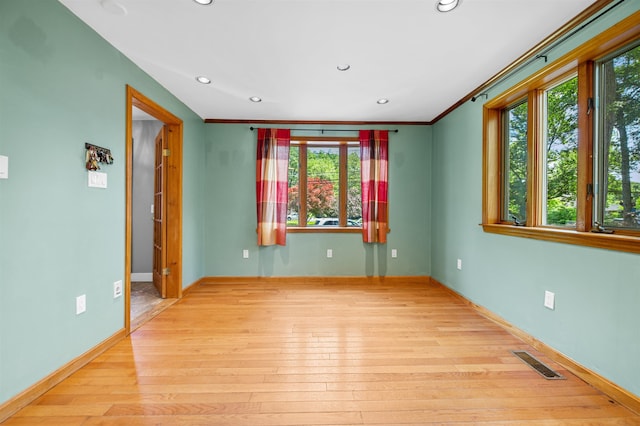 17 N Ave, Plaistow, NH 03865 - unfurnished room featuring healthy amount of natural light, wood-type flooring, recessed lighting, and crown molding
